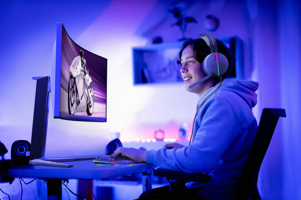 Teenager gaming online in his bedroom